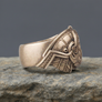 Bronze Ring Huggin and Munninin a rocky surface