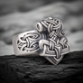 Sterling Silver Mjolnir Ring on a dark rocky surface