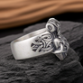 Sterling Silver Mjolnir Ring on a dark rocky surface