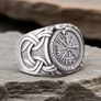 Silvered Bronze Viking Ring With Vegvisir and Jormungandr on a rocky surface