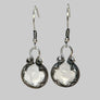 Gotland Silver earrings with white gemstones on a white background