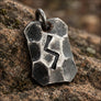 Close-up of Sowulo sun rune on hand forged steel pendant