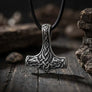 Back view of 925 sterling silver Mjolnir pendant with intricate knotwork, hanging from a black leather cord