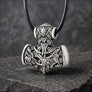 Silvered bronze Viking Mjolnir pendant with wolf and raven motifs on dark stone