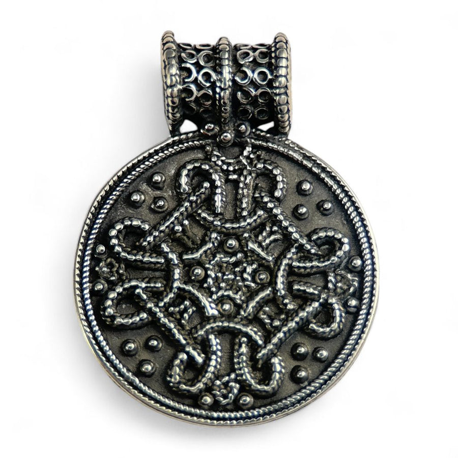 Silver Birka pendant with intricate design on a white background