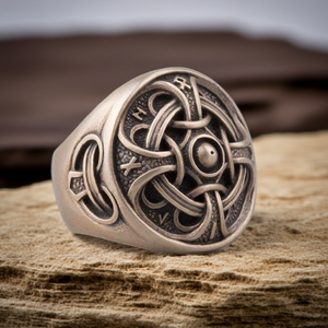 Hail Odin Bronze ring with intricate design on a wooden surface