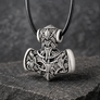 Silvered bronze Viking Mjolnir pendant with wolf and raven motifs on dark stone