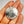 Silver Spartan shield pendant held in a hand with a plain background