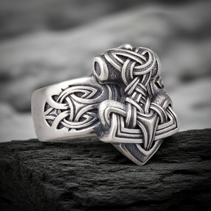 Sterling Silver Mjolnir Ring on a dark rocky surface