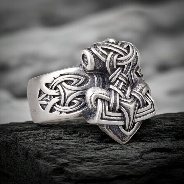 Sterling Silver Mjolnir Ring on a dark rocky surface