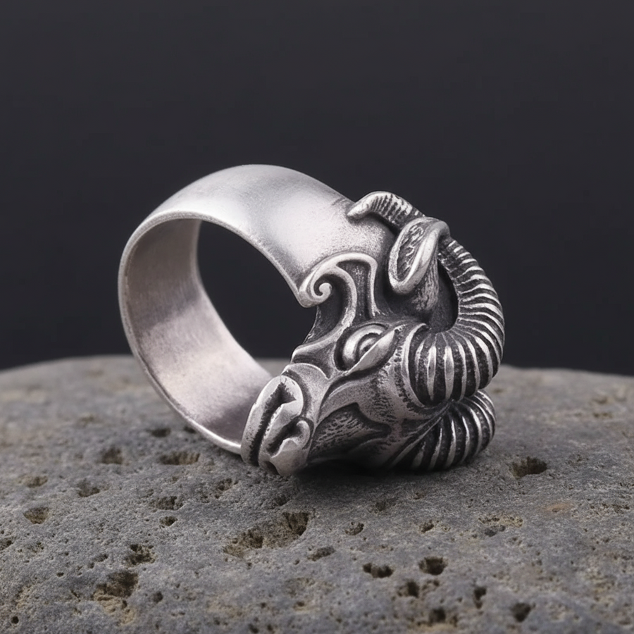 Silvered ram head ring on a rocky surface