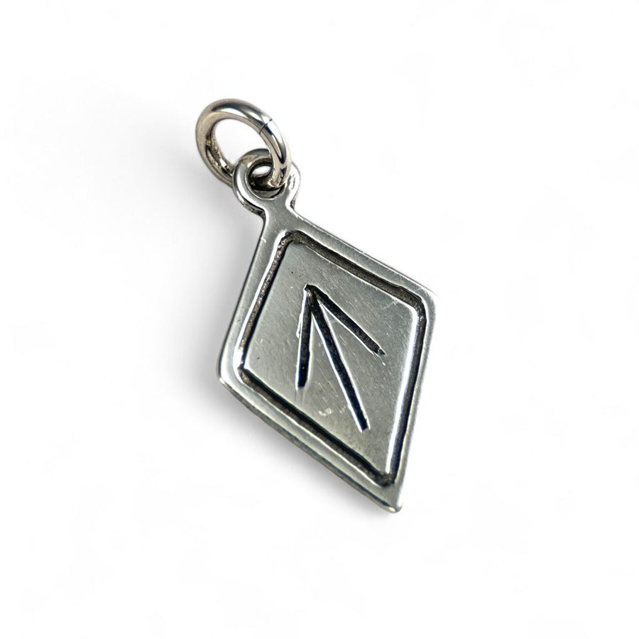 Silver Tiwaz pendant with a kite design on a white background