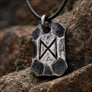 Close-up of Dagaz rune symbol on hand forged steel pendant