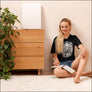 Women’s Freya’s Fire Norse graphic tee in black worn indoors as casual everyday outfit
