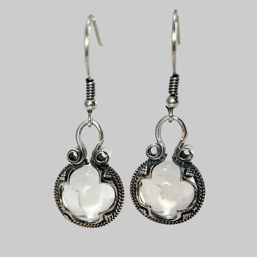 Gotland Silver earrings with white gemstones on a white background