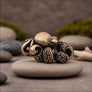 Angled view of octopus bronze figurine displayed on natural stone