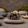 Side view of octopus bronze figurine showing curled tentacles and antique bronze texture