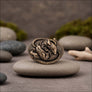 Sleeping Rats miniature animal figurine displayed on natural stone in an angled front view