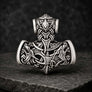 Front view of silvered bronze Viking Mjolnir pendant with wolf, raven and Norse knotwork details
